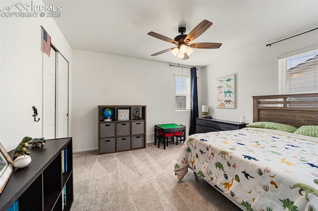 bedroom featuring light carpet, a closet, and ceiling fan