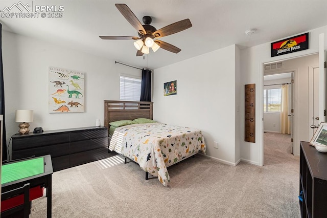 carpeted bedroom with ceiling fan