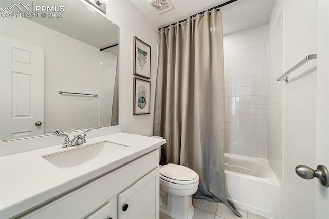 full bathroom with tile patterned flooring, vanity, toilet, and shower / bath combo with shower curtain