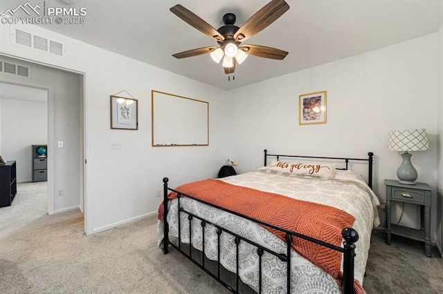 bedroom featuring ceiling fan and light carpet