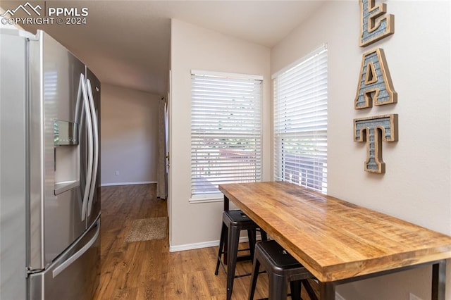 dining space with hardwood / wood-style floors