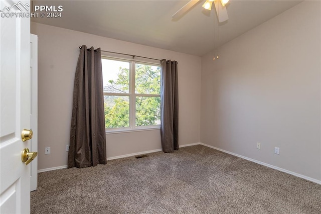 spare room with ceiling fan and carpet floors