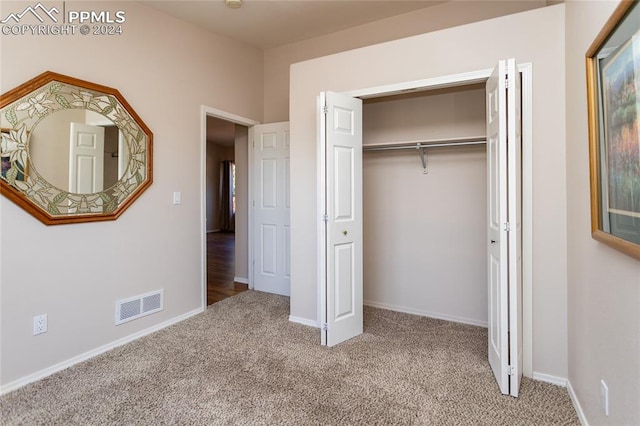 unfurnished bedroom featuring a closet and carpet