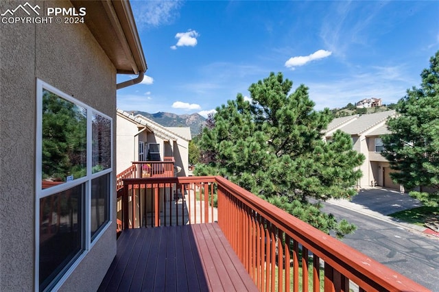 wooden terrace with a mountain view