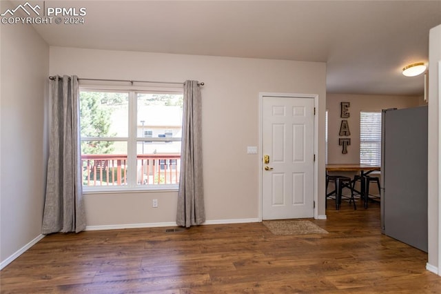 foyer with dark hardwood / wood-style floors