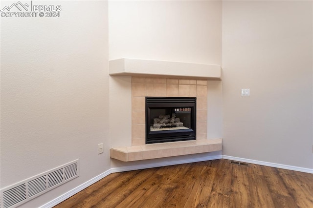 details with a fireplace and hardwood / wood-style flooring