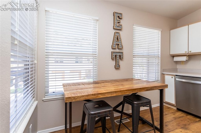 dining space with light hardwood / wood-style floors