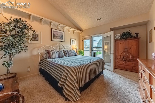 carpeted bedroom featuring a textured ceiling, access to exterior, and lofted ceiling