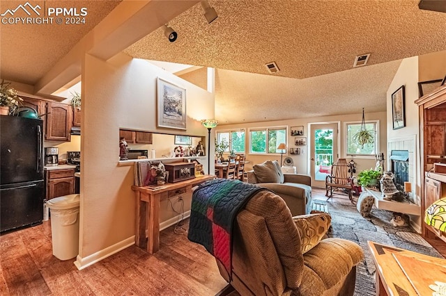 interior space featuring a textured ceiling and light hardwood / wood-style flooring