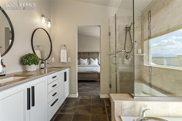 bathroom featuring an enclosed shower, vanity, and tile patterned flooring