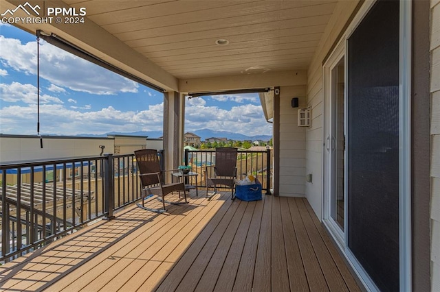 wooden deck with a mountain view