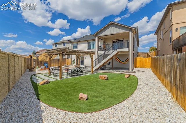 rear view of house featuring a patio area, an outdoor living space, a lawn, and a pergola