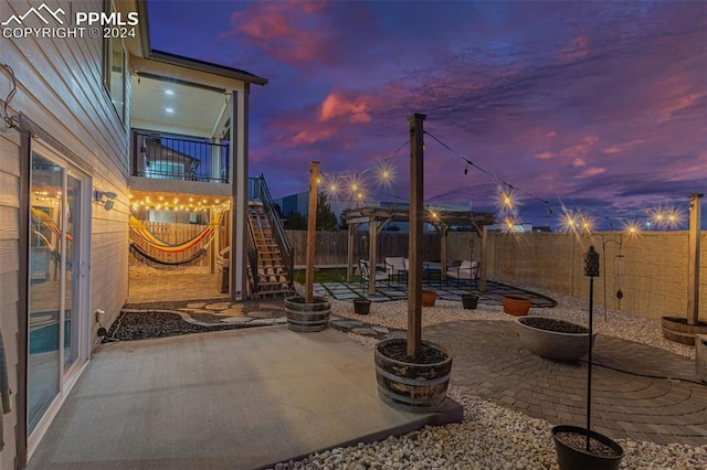 patio terrace at dusk with a pergola