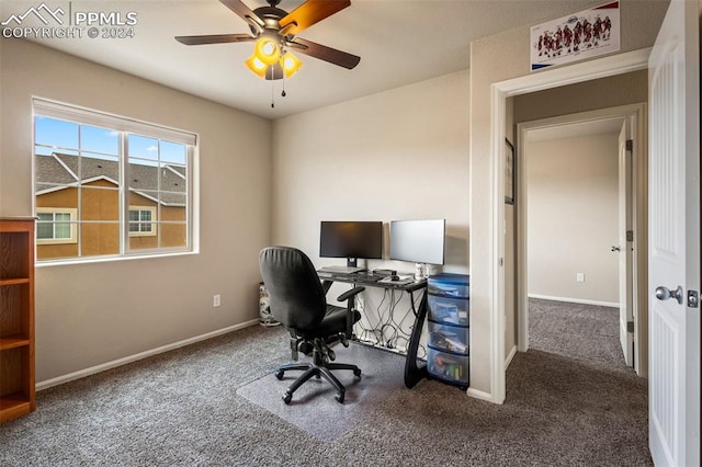 carpeted office space with ceiling fan