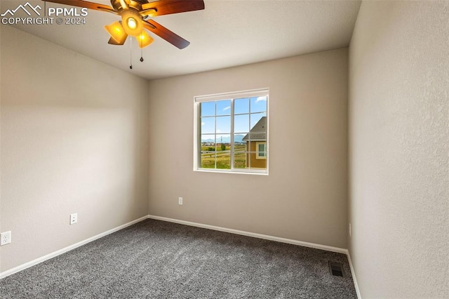 spare room with ceiling fan and carpet floors