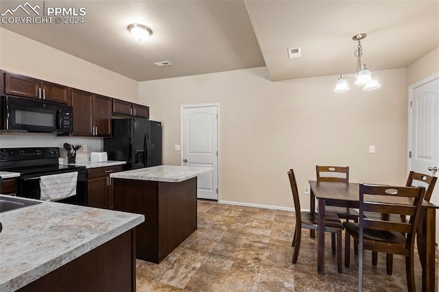 kitchen featuring a center island, an inviting chandelier, decorative light fixtures, black appliances, and dark brown cabinets