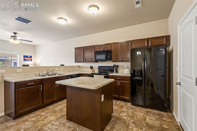 kitchen with black appliances, kitchen peninsula, a kitchen island, sink, and ceiling fan