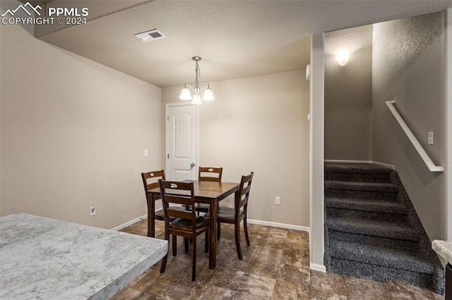 dining room with a chandelier