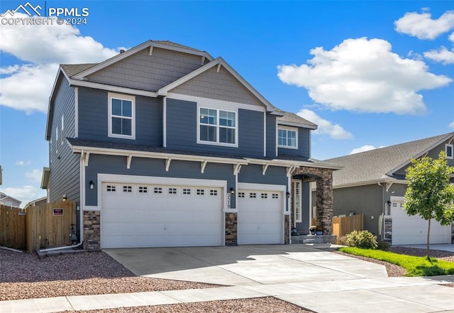 craftsman house with a garage