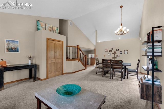 carpeted dining room with high vaulted ceiling and a notable chandelier