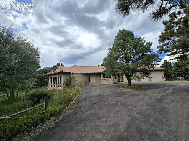 ranch-style house featuring a garage