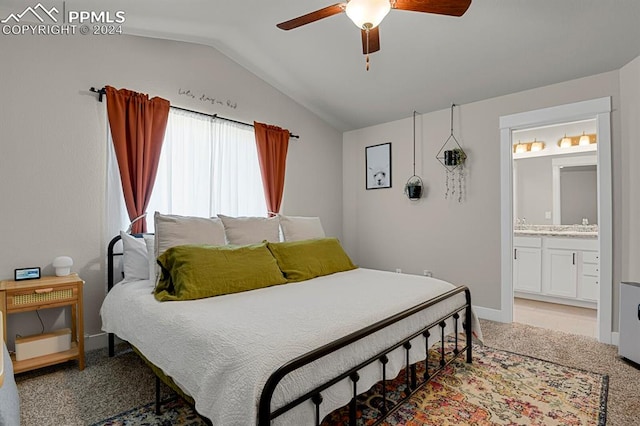 bedroom with lofted ceiling, ceiling fan, carpet floors, and ensuite bath