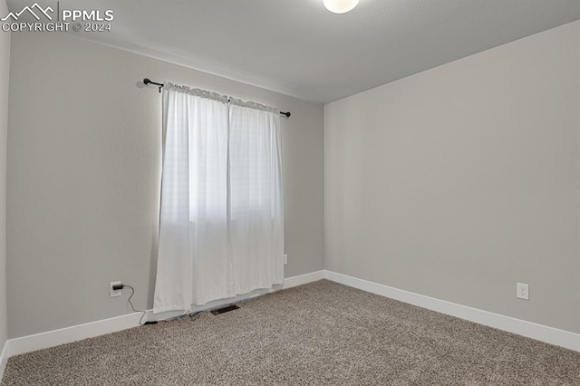 spare room with carpet flooring