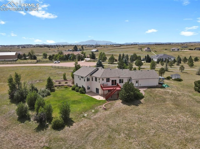 bird's eye view with a rural view and a mountain view