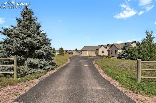 view of front of house featuring a front yard and fence