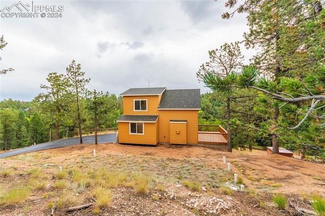 view of front of house featuring a wooden deck