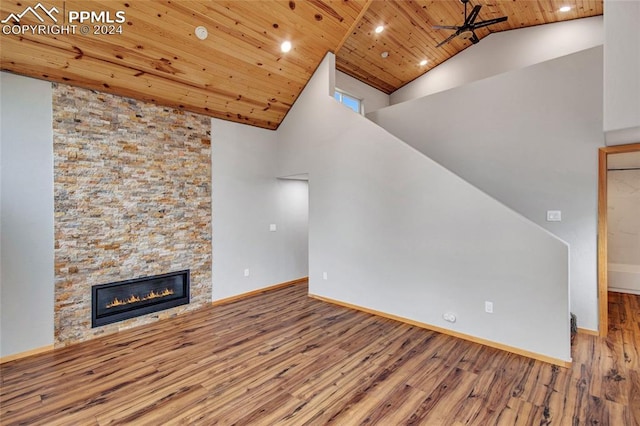 unfurnished living room with wooden ceiling, a fireplace, wood-type flooring, high vaulted ceiling, and ceiling fan