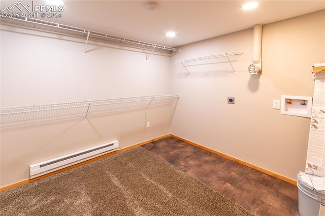 spacious closet with a baseboard radiator and carpet