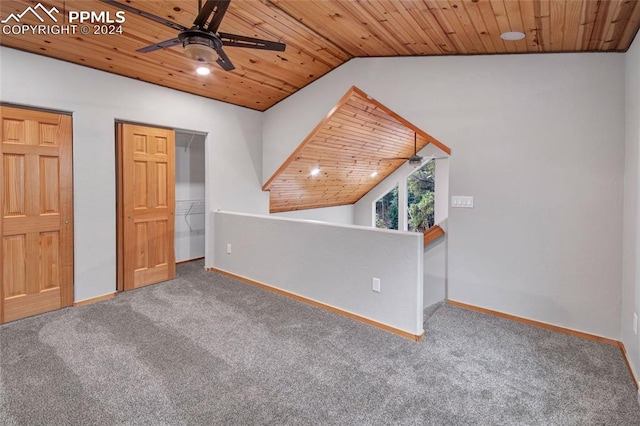 interior space with wood ceiling, carpet floors, and lofted ceiling