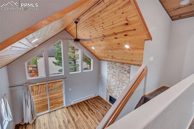 bonus room with a baseboard radiator, a fireplace, wood-type flooring, and wooden ceiling