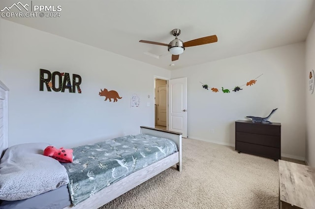 carpeted bedroom with ceiling fan