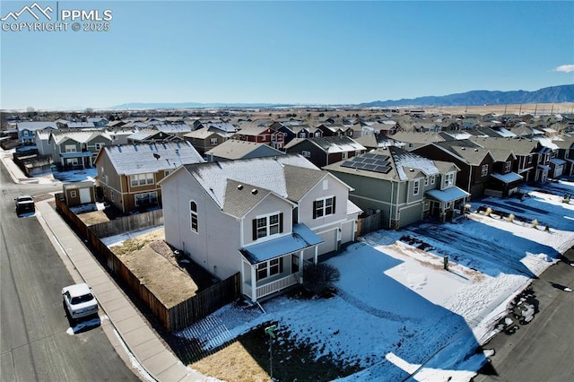 birds eye view of property with a mountain view