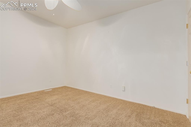 spare room with ceiling fan and carpet floors