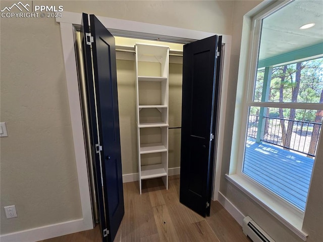 closet with a baseboard radiator