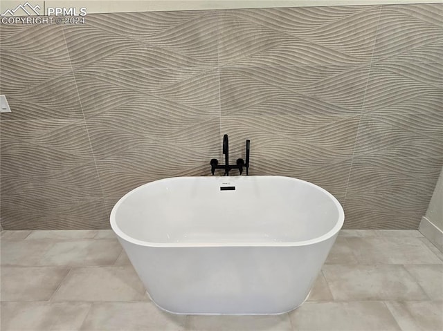 details with tile patterned flooring and a bath