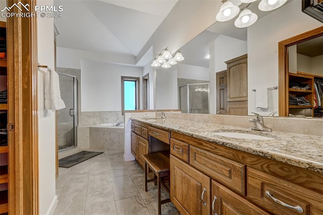 bathroom with lofted ceiling, vanity, independent shower and bath, and a notable chandelier