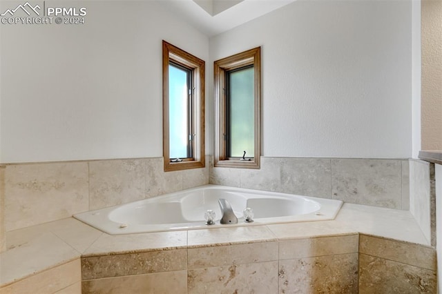 bathroom with tiled tub