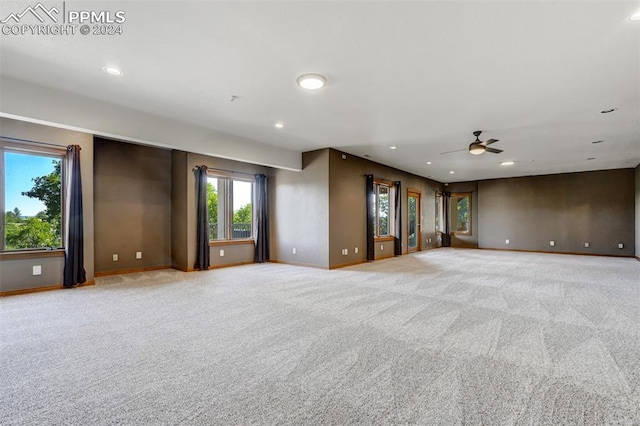 carpeted empty room with ceiling fan