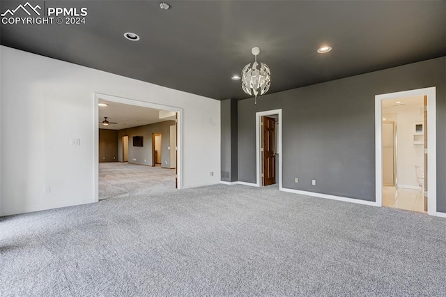 carpeted empty room with ceiling fan