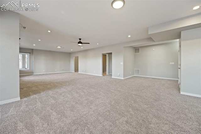 empty room with light carpet and ceiling fan