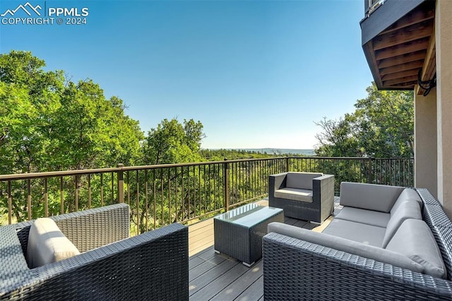 wooden deck featuring outdoor lounge area