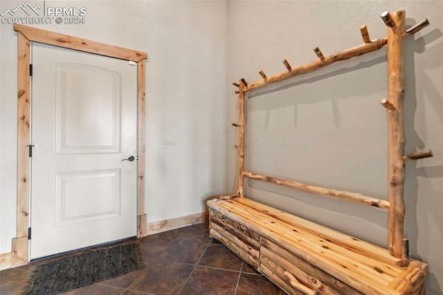 interior space with dark tile patterned flooring