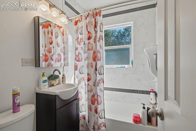 full bathroom with vanity, toilet, and shower / tub combo with curtain