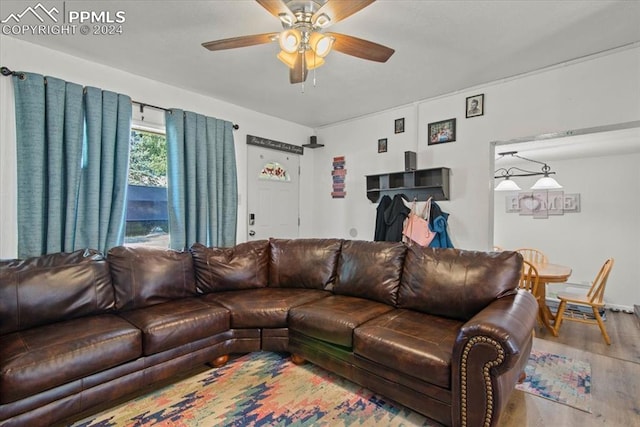 living room with wood-type flooring and ceiling fan