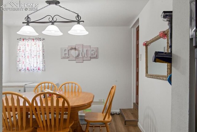 dining area featuring hardwood / wood-style floors