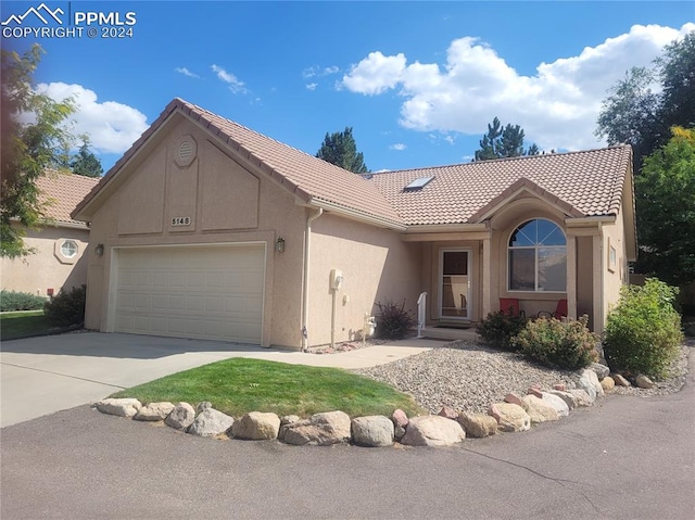 view of front of property with a garage